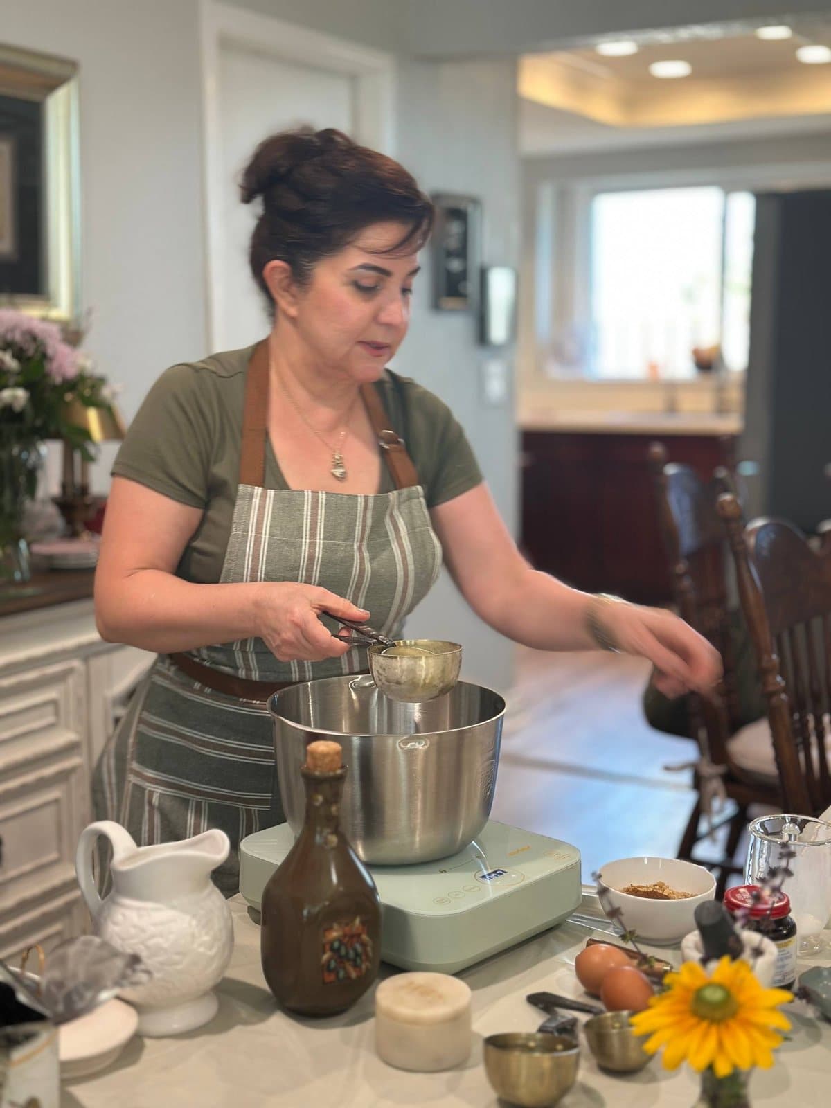 Measuring into the mixer bowl at the start of a Danish pastry workshop